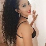 Latina Tanesha, rassiges Girl mit langen Haaren. Bild